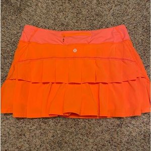 Size 10 Lululemon tennis skirt in orange.